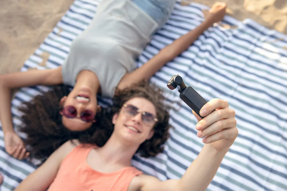 DJI Osmo Pocket - 3-Axis Gimbal Stabiliser with integrated camera, snaps 12MP photos, 1/2.3-inch sensor, shoot 4K/60fps video at 100 Mbps and 4x slow-motion video at 1080p/120fps